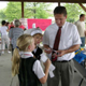 3rd grader Katie Brown (Mason) sells cheesecake raffle tickets to 5th grade teacher Matt Schlotman (Mason) as 5th grader Bradley Wier (Mason) looks on.