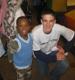 An angel (Michael Brown) with a young charge.