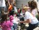 Kansas missionaries help run a kids' activity during the missions.