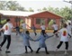 Children and missionaries together enjoy a game in the school patio.