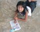 Coloring with the children always brings them joy.