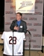 Dan Burch, the emcee for the event, introduces the speakers.