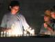 Palestinian Challenge girls light candles at the chapel of the Dormition of Our Lady.