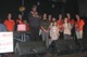 Jim Littleton, surrounded by his family, addresses those attending the benefit event.