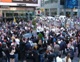 The group gathers in Times Square to pray a decade of the Rosary and sing a hymn to Mary.