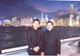 Fr Joseph Tham and Fr Mattias Kim stand before the Hong Kong skyline.