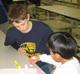 Conquest boys gave the gift of their time and attention to the 2nd graders in their parish.