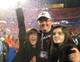 Terry Malone and two of his daughters relish the taste of victory.