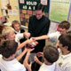 Fr. Timothy Mulcahey LC checks the �souls� of fifth graders (clockwise from Father) William O�Brien, Nicholas Alves, Luke Bick, Hugh Cole, Garrett Martin, Danny DeSimon, John O�Brien, and John Esswein.