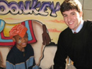 Patrick Metts, a co-worker from Atlanta, enjoying a moment with a young friend