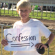 An ECYD boy promotes the sacrament of Confession.