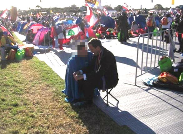 Fr Michael Sliney, LC, hearing confessions.