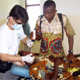 Dr. Jimenez, DDS from Cleveland, OH providing dentistry care to a patient in Bibiani.