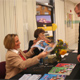 Dr. Coleen Kelly Mast gives some of her educational materials to David Olejnik of Shelby Township, Michigan, who came to hear her speak at the school open house for Everest on Nov. 9, 2008.
