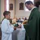 Matthias receives his missionary cross from Father Cliff Ermatinger, LC.