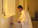 Fr Eamonn Shelly, LC anoints the walls of the chapel.