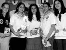 In the moments before the fashion show, the ladies of Club Alps distributed material about the club"s mission trip to Mexico and summer camp in Avila.