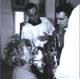 Mrs. Sagrario Amo Arturo receiving communion from her son.